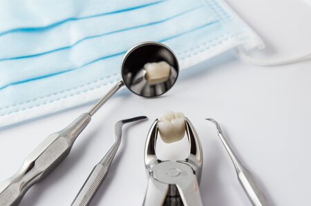 dental tools and extracted tooth on counter, dentist Melrose, MA family dentistry
