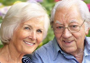 old couple outdoors smiling with nice teeth, dentures in Clinton Township, MI