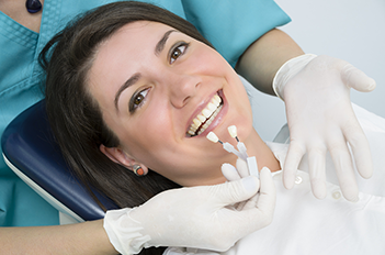 woman in dental office getting professional teeth whitening Detroit, MI