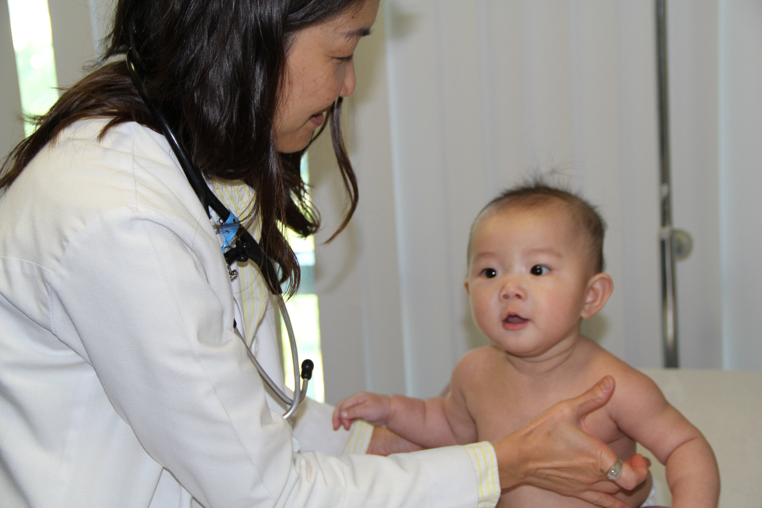 Dr. Han with a young patient