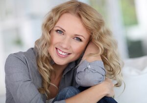 blond woman smiling beautiful teeth cosmetic dentistry West Bloomfield, MI