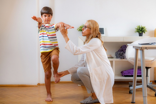 Child being examined by pediatrician during routine physical checkup.