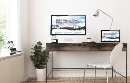 home office desk with computer and tablet screen