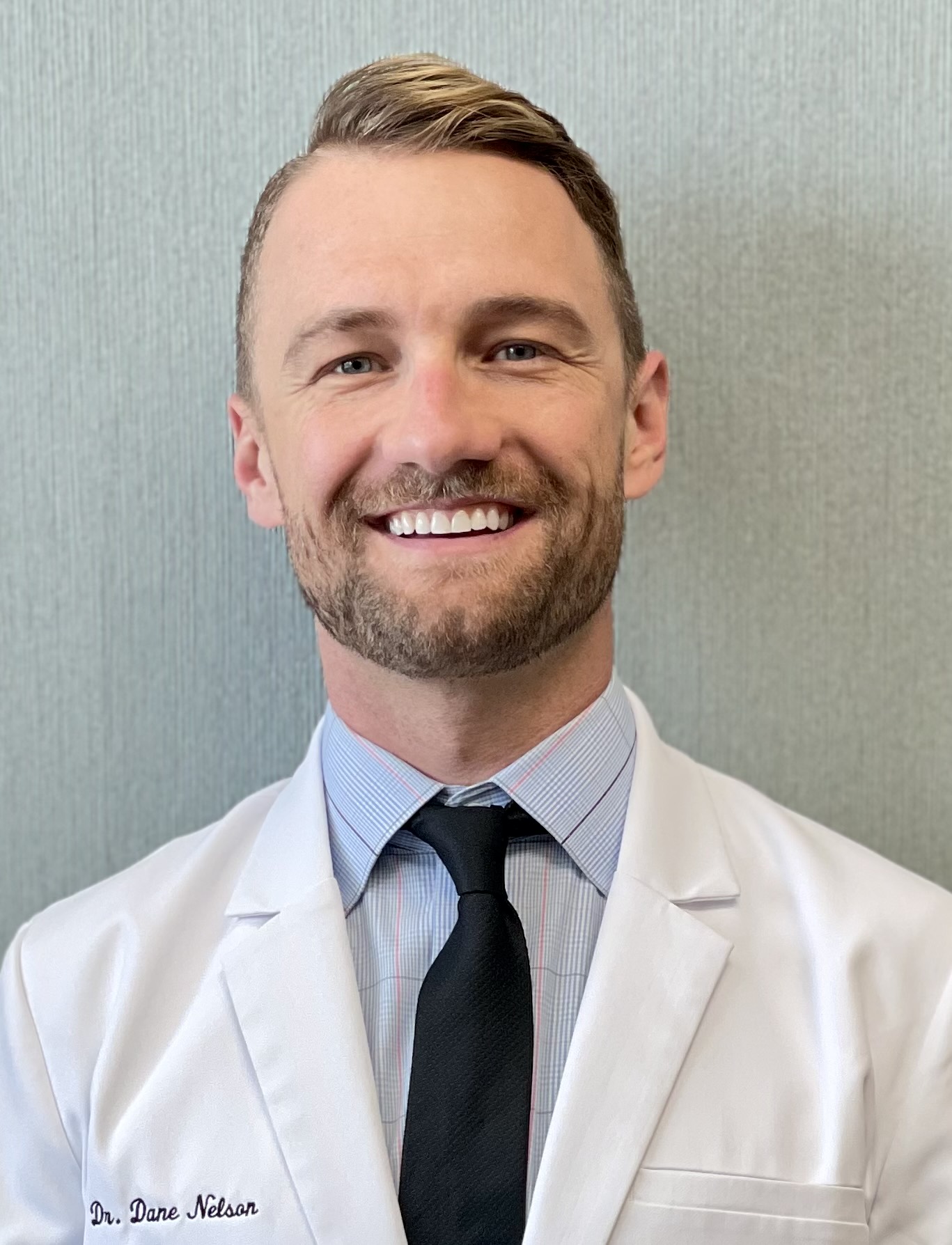 Please welcome Dr. Dane Nelson as the new owner and doctor of Aberdeen Dental!  Dr. Nelson grew up in Stillwater, Minnesota. He attended the University of Wisconsin-Madison where he graduated with honors. He then returned to the University of Minnesota School of Dentistry where he earned his Doctorate in Dental Surgery (DDS) degree in 2016.   After graduation, he started his career serving our country as a lieutenant in the U.S. Navy Dental Corps. During his active duty time, he completed an Advanced Education in General Dentistry residency in the Chicago area, served overseas at a Marine Corps base in Iwakuni, Japan where he was awarded a Navy & Marine Corps achievement medal for his excellence in clinical work, and led a dental clinic in Washington state. Dr. Nelson has over 8 years of clinical experience, and over 4 years in private practice. He has treated tens of thousands of patients of all ages and dental needs in his career and he is now excited to fulfill his dream of owning a dental practice!  Dr. Nelson is particularly passionate about comprehensive patient care, especially restoring or replacing missing teeth for esthetic and healthy smiles. He keeps up on these modern dental treatments through extensive continuing education coursework and has completed over 10 times the required hours needed to keep his license active. He has completed extensive training in esthetic dentistry and surgical implant dentistry including a year-long implant surgery program with the American Academy of Implant Dentistry held in Vancouver, Canada.  In his personal life, Dr. Nelson is an avid traveler and sports & outdoors enthusiast. He has even lived abroad in three different countries - Spain, Denmark & Japan! He enjoys running, biking, hiking, camping, fishing, snowboarding, nordic skiing, and spending time with his family & friends. Dr. Nelson is excited to meet you and to take great care of the patients of Aberdeen Dental!