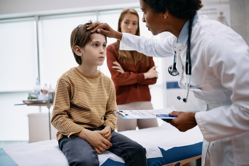 Pediatric Sick Visit Child being examined by a pediatrician due to illness
