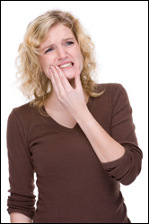 Woman experiencing TMJ Pain