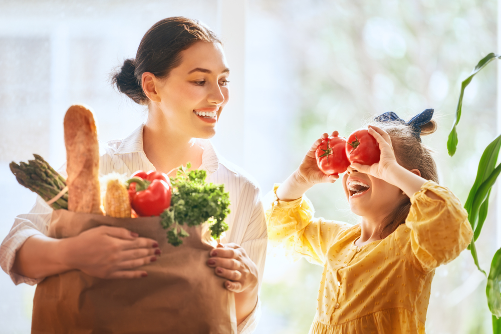 Family with healthy food smiling