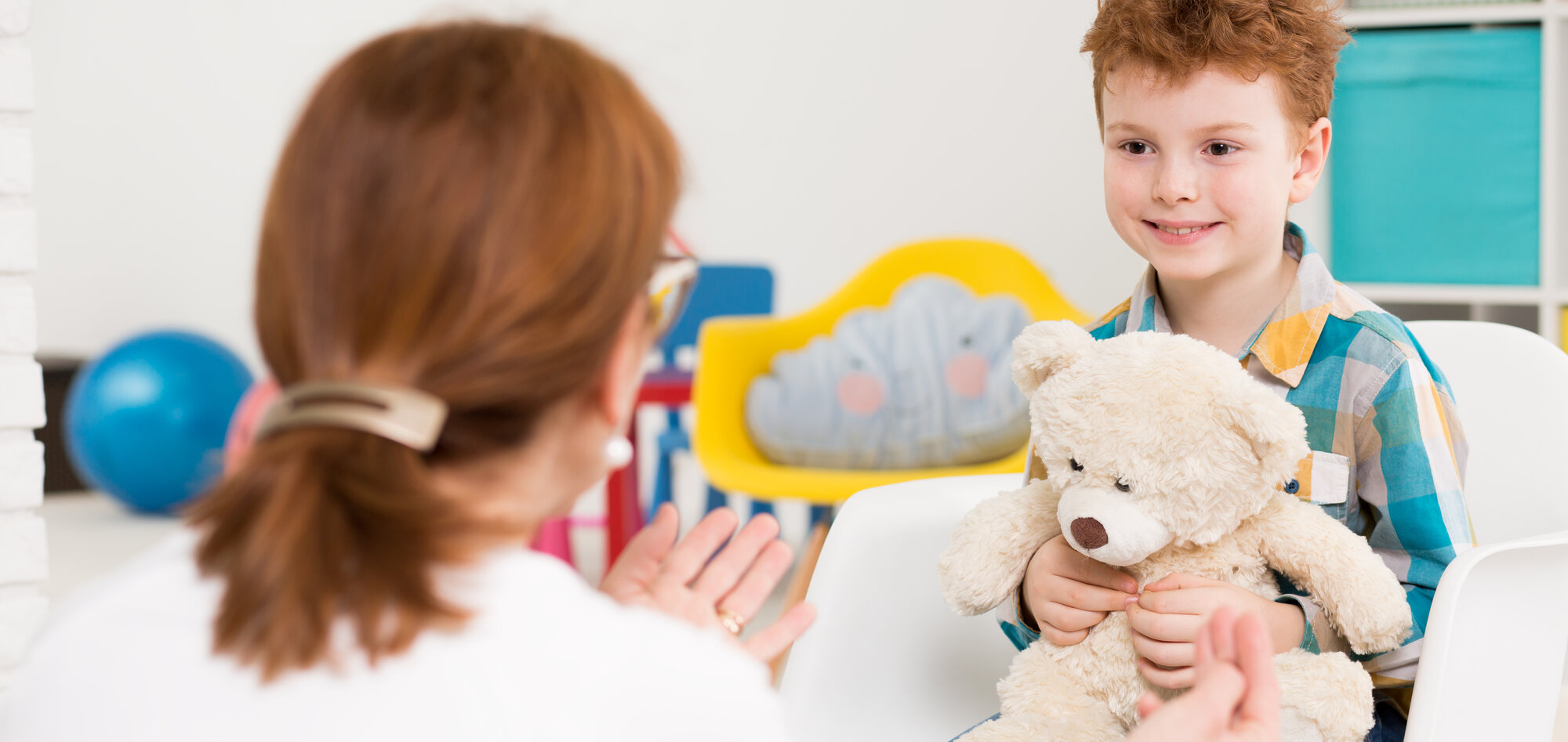 Pediatrician with child patient