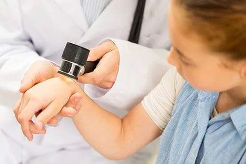 person getting skin checked